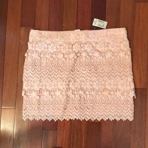 Pink lace mini skirt